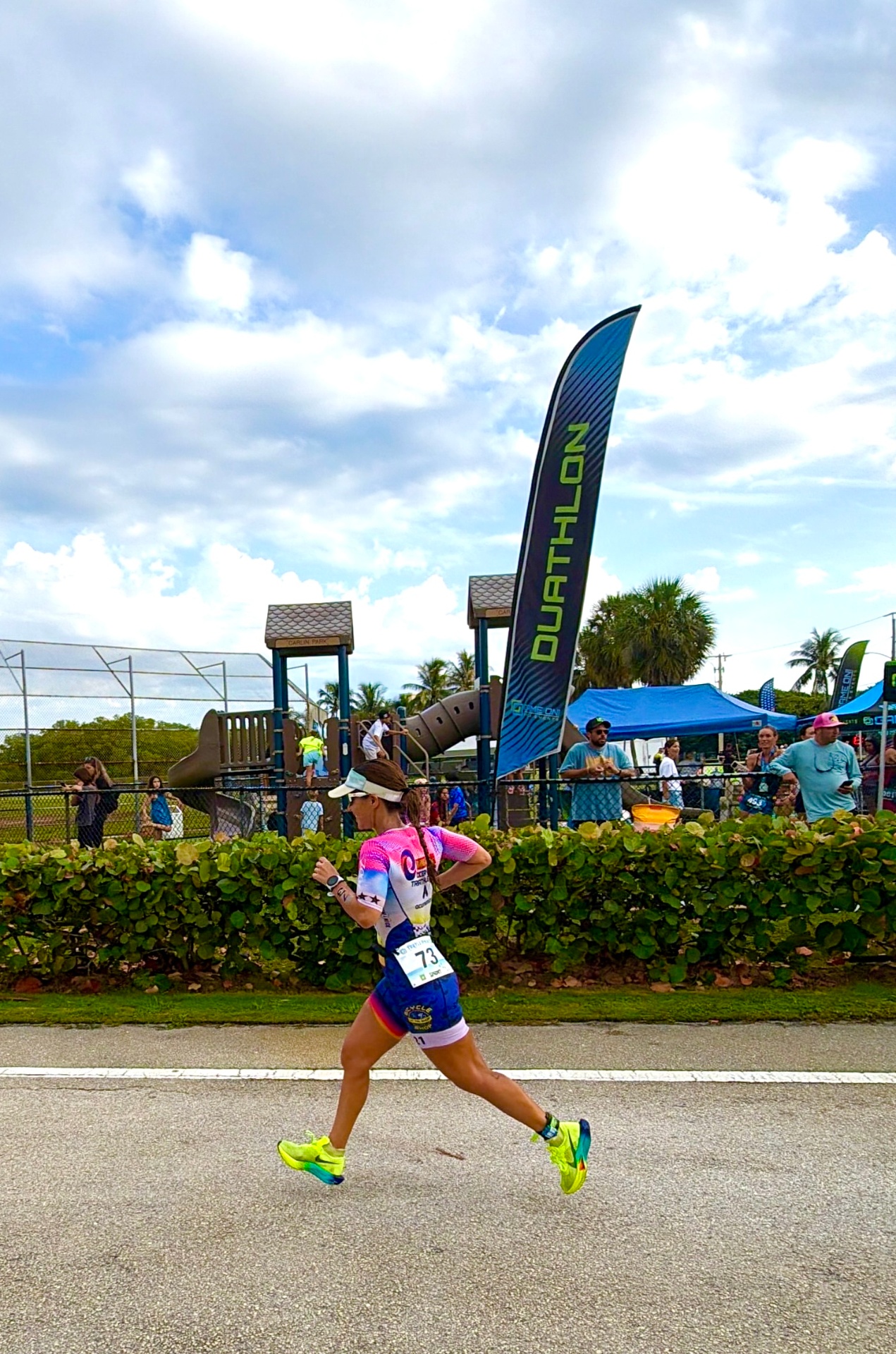Dr. Hadar running the duathlon course at Carlin Park in full triathlon kit