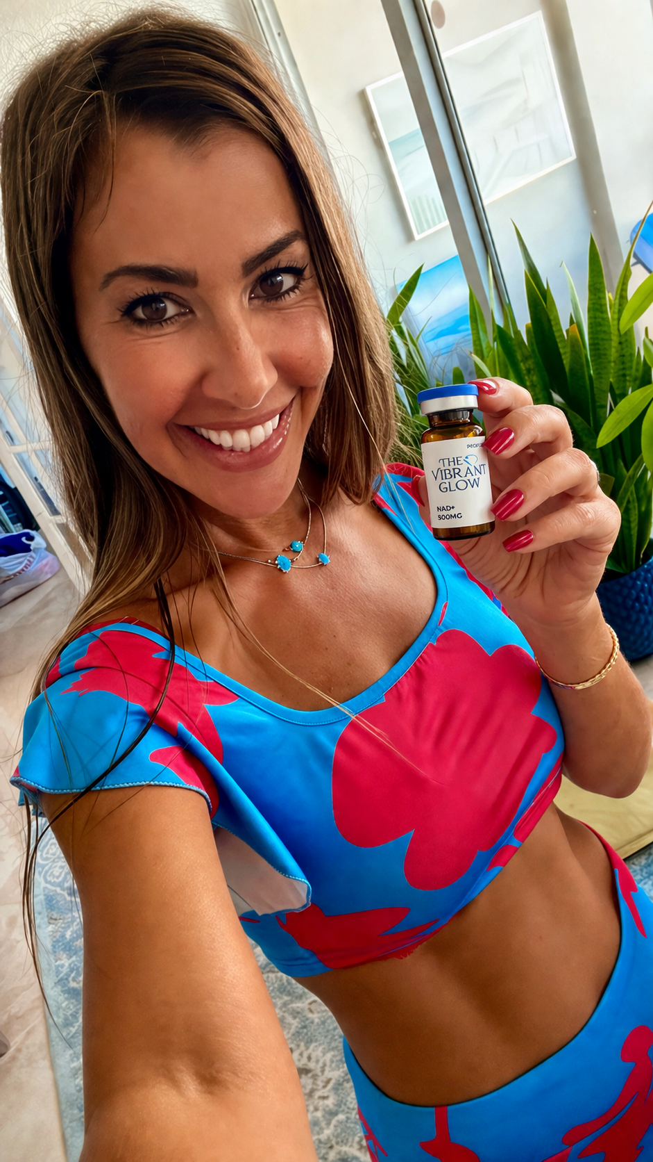 Dr. Hadar holding a Vibrant Glow NAD+ vial